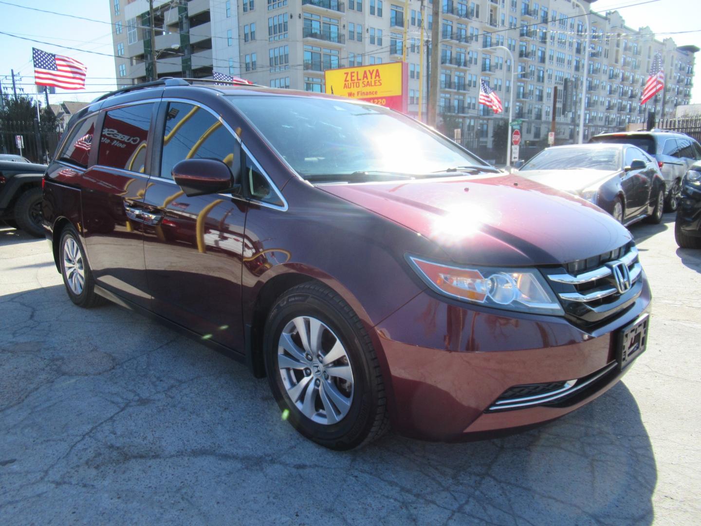 2016 Red /Tan Honda Odyssey EX-L (5FNRL5H62GB) with an 3.5L V6 SOHC 24V engine, Automatic transmission, located at 1511 North Shepherd Dr., Houston, TX, 77008, (281) 657-1221, 29.798361, -95.412560 - 2016 HONDA ODYSSEY EX-L VIN: 5FNRL5H62GB103369 5 F N R L 5 H 6 2 G B 1 0 3 3 6 9 VAN 3.5L V6 F SOHC 24V GASOLINE FRONT WHEEL DRIVE - Photo#0